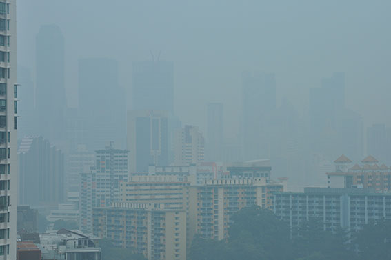 Smoke haze from peat fires in Sumatra, Singapore October 1, 2015.